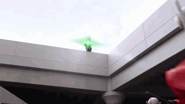 a green light is coming out of a building