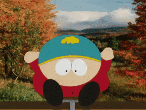 a cartoon character from south park is sitting on a table