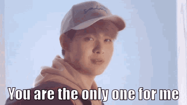 a man wearing a baseball cap and a hoodie says you are the only one for me