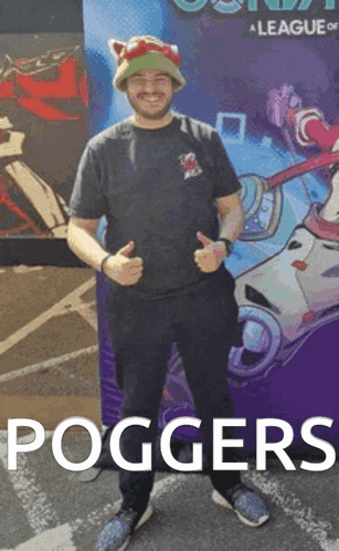 a man is giving a thumbs up in front of a league of legends poster