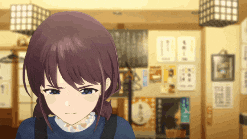 a girl with purple hair and blue eyes is standing in front of a wall with posters on it