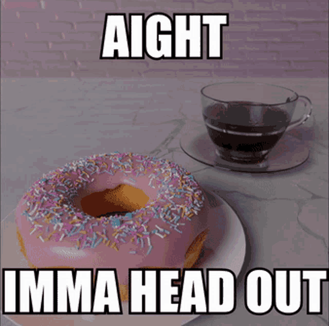 a pink donut with sprinkles sits next to a cup of coffee