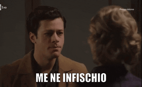 a man and a woman are looking at each other and the man says me ne infischio