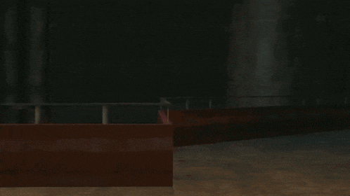 a man and a woman are hugging in a dark room in a video game