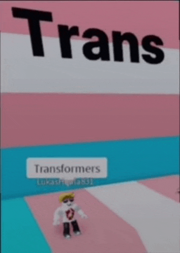 a picture of a person standing in front of a sign that says transformers