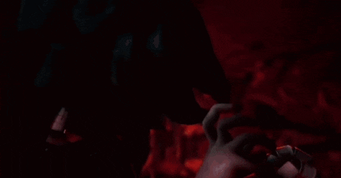 a close up of a person 's face with a glowing light coming out of it .