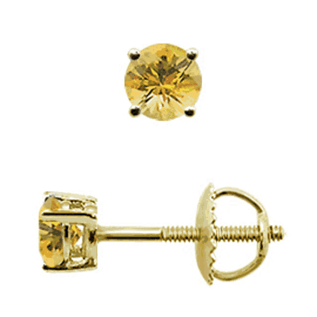 a pair of yellow gold stud earrings with a yellow stone in the center
