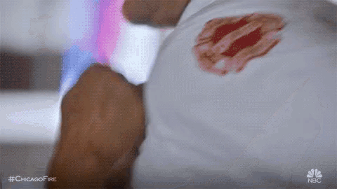 a close up of a person 's arm with a bloody wound on it .