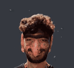 a man with a beard has a large nose and a huge head