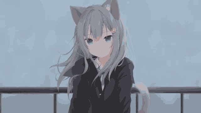 a girl with cat ears and blue eyes is wearing a black suit