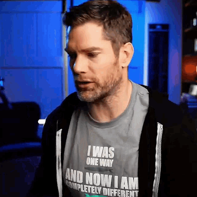 a man is wearing a t-shirt that says i was one way and now i am completely different