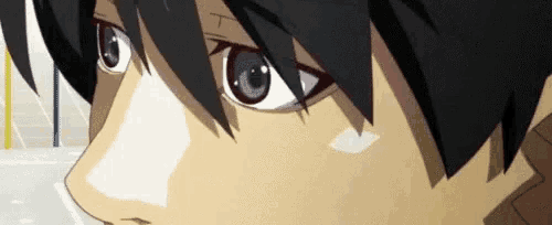 a close up of a person 's face with a black haired anime character .