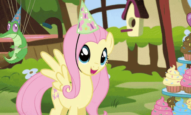 a cartoon pony wearing a party hat stands in front of cupcakes and a birdhouse