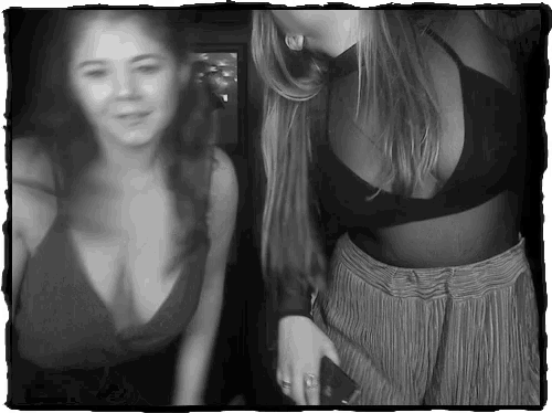 two women are standing next to each other and one has a bra on