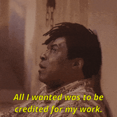 a man leaning against a wall with the words " all i wanted was to be credited for my work "