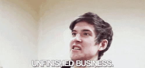 a young man is saying `` unfinished business '' while looking up .