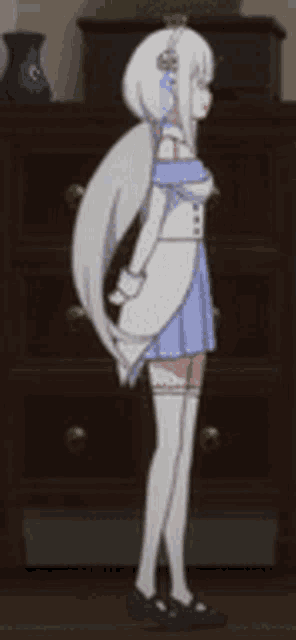 a girl with white hair is standing in front of a wooden dresser .