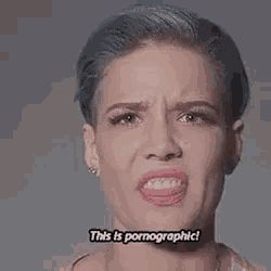 a close up of a woman 's face with the words `` this is pornographic '' written on it .