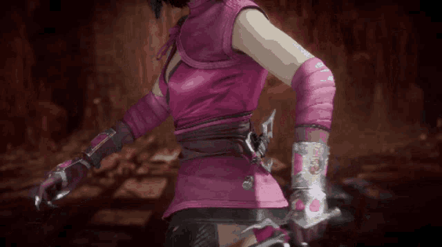 a woman in a pink costume holds a sword