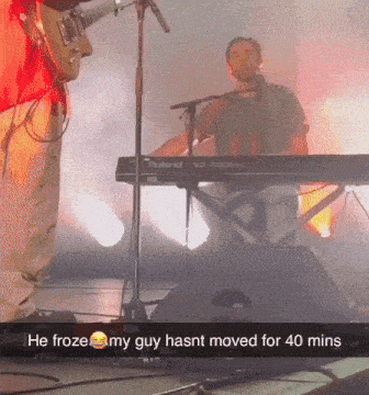 a man playing a keyboard with the words he froze my guy hasnt moved for 40 mins on the bottom