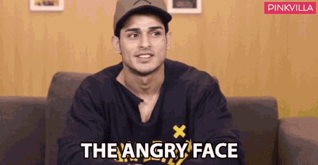 a man sitting on a couch with the words " the angry face " written on the bottom