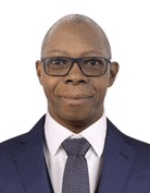 a man in a suit and tie is wearing glasses and smiling .