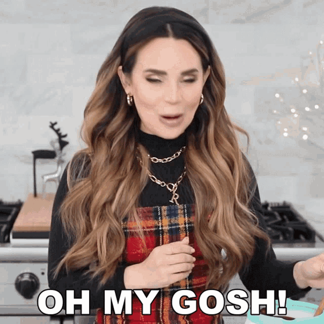 a woman says oh my gosh while holding something