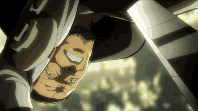 a man is upside down with a smile on his face and the letter c on his shirt