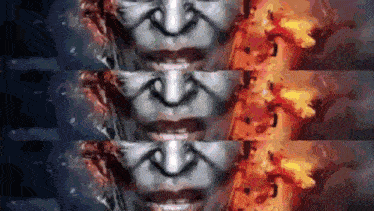 a close up of a person 's face with fire coming out of it
