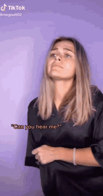 a woman says " can you hear me " in a tiktok video