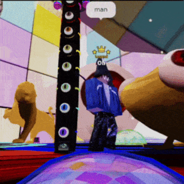 a man in a blue shirt is standing in front of a stage with a speech bubble saying man