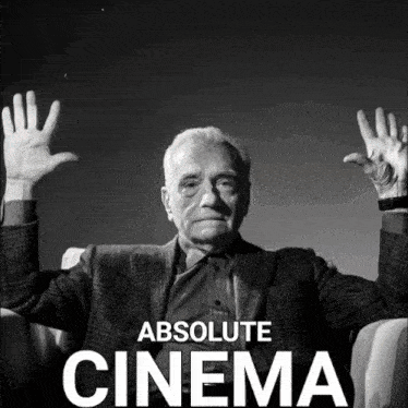 a black and white photo of a man with his hands in the air and the words absolute cinema below him