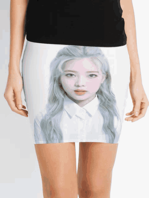 a woman is wearing a pencil skirt with a picture of a girl with blonde hair