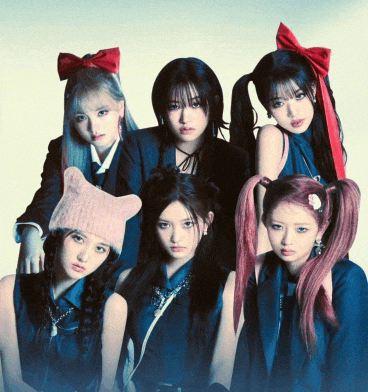 a group of girls are posing for a picture and one of them is wearing a pink cat hat