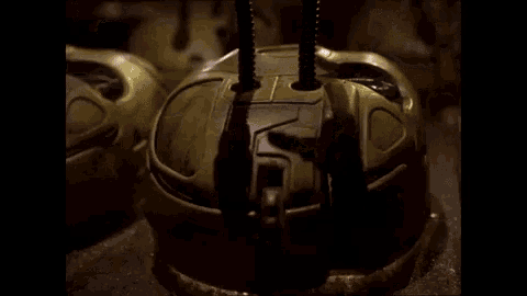 a close up of a robot 's head with lights on .