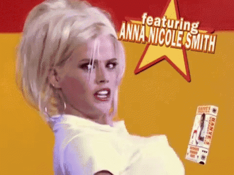 a woman in a white shirt is standing in front of a yellow star that says featuring anna nicole smith
