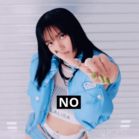 a woman in a blue jacket is pointing at the camera with the word no written on it
