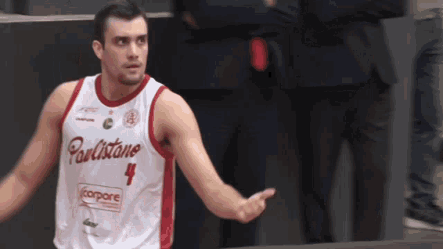 a basketball player wearing a uniform that says paulistano