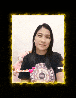 a woman wearing a black shirt with the word mamavie on it