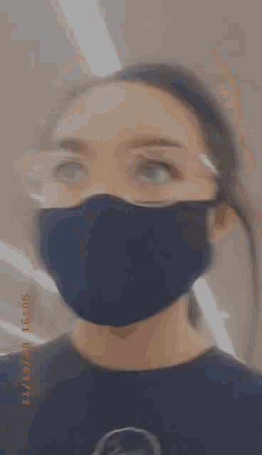 a blurry photo of a woman wearing a face mask