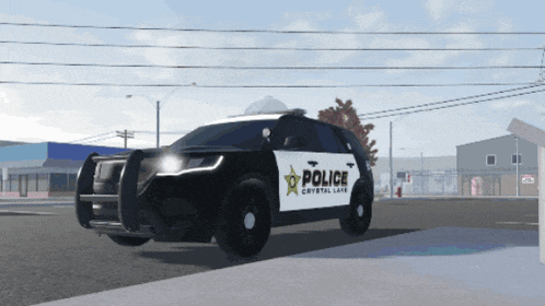 a black and white police car from crystal lake is parked on the side of the road