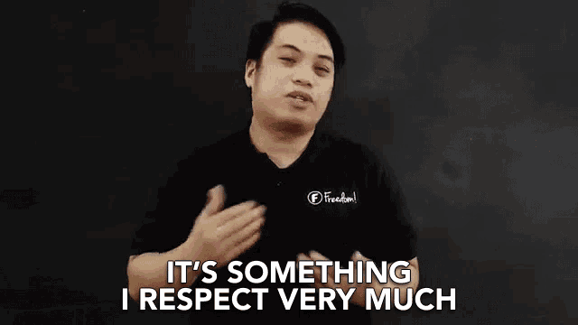 a man is standing in front of a blackboard and saying `` it 's something i respect very much ''