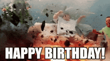 a man is sitting on a couch in front of an explosion with the words happy birthday written on it