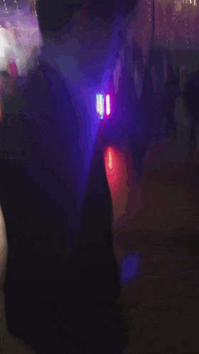 a blurry picture of a dark room with a red light