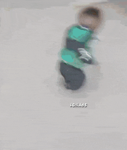 a child is crawling on the floor with the words igkids on the bottom left