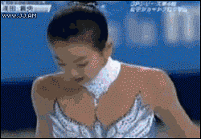 a pixelated image of a female ice skater with the website www.jjam at the bottom