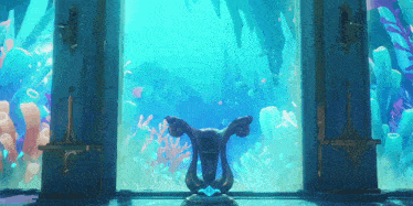 a statue in front of a window with a view of the ocean