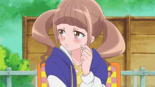 a cartoon girl with pigtails and a blue jacket