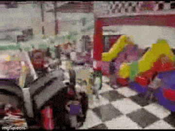 a blurry picture of a toy store with a checkered floor and toys .