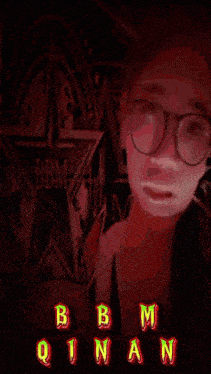 a picture of a woman with glasses and the name qinan on the bottom